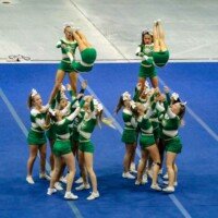 The BMS competition cheerleading team performs a stunt at the Family and Friends Showcase in September. Photo by Alicia Payne.