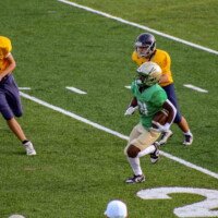 Buford's Kylan Baker rushes with the ball. Photo by Alicia Payne