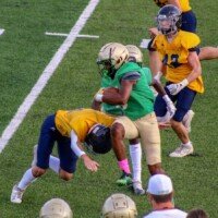 Justin Hawthorne tries avoiding a Marist defender. Photo by Alicia Payne