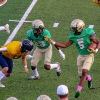 Justin Hawthorne looks to get around a Marist defender. Photo by Alicia Payne