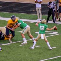 Buford quarterback Micah Johnson tosses the ball to an open receiver. Photo by Alicia Payne