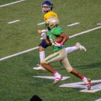 Silas Knuckles breaks away for a touchdown. Photo by Alicia Payne