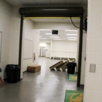 A door can be raised to allow for two separate locker rooms to essentially become one massive locker room.