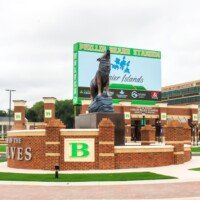 A massive wolf statue greets visitors to Phillip Beard Stadium.